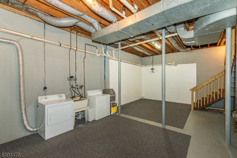 8 Constitution Way Franklin, NJ 07416 - Photo 23 of 26 a utility room with dryer and washer