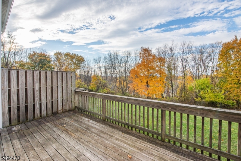 8 Constitution Way Franklin, NJ 07416 - Photo 24 of 26 a view of a balcony with wooden fence