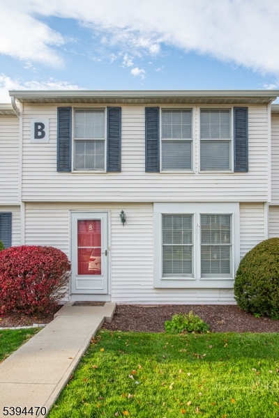 8 Constitution Way Franklin, NJ 07416 - Photo 3 of 26 a front view of a house with a garden