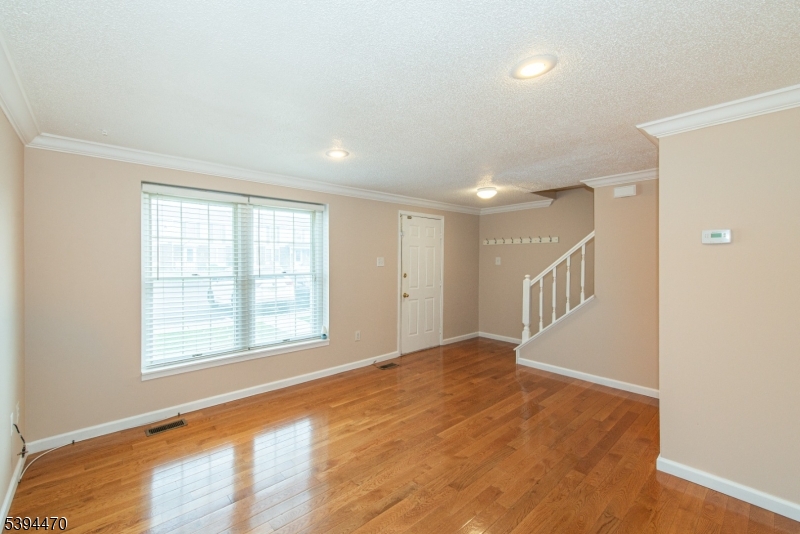 8 Constitution Way Franklin, NJ 07416 - Photo 6 of 26 a view of an empty room with a window