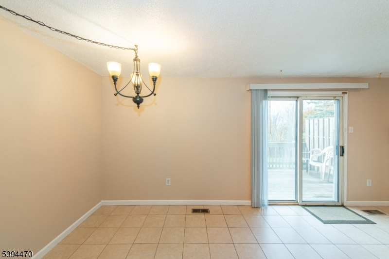 8 Constitution Way Franklin, NJ 07416 - Photo 9 of 26 a view of a room with an empty space and a window