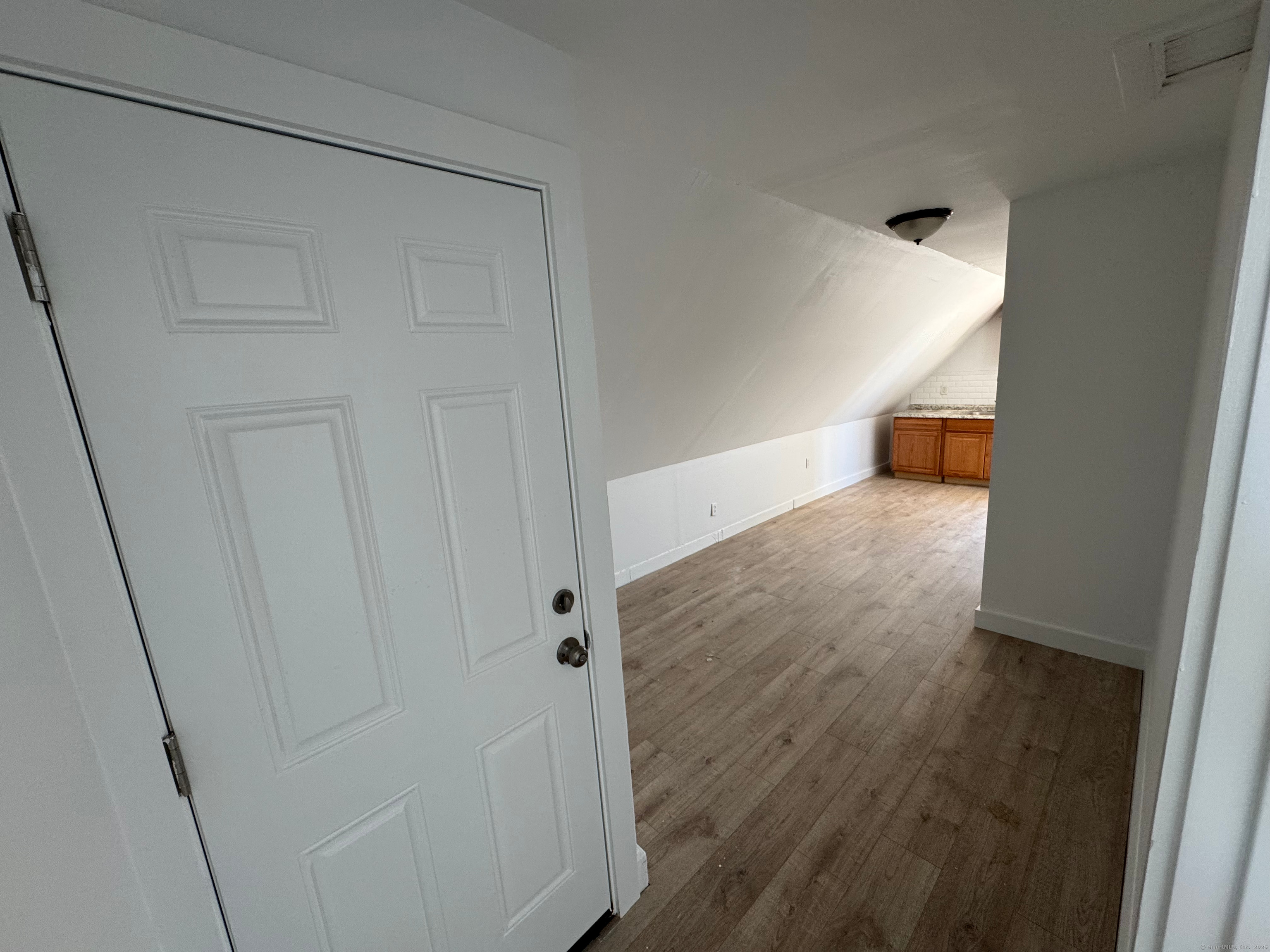 10 Beatrice Street, Unit 3 Bridgeport, CT 06607 - Photo 6 of 12 a view of a hallway with wooden floor