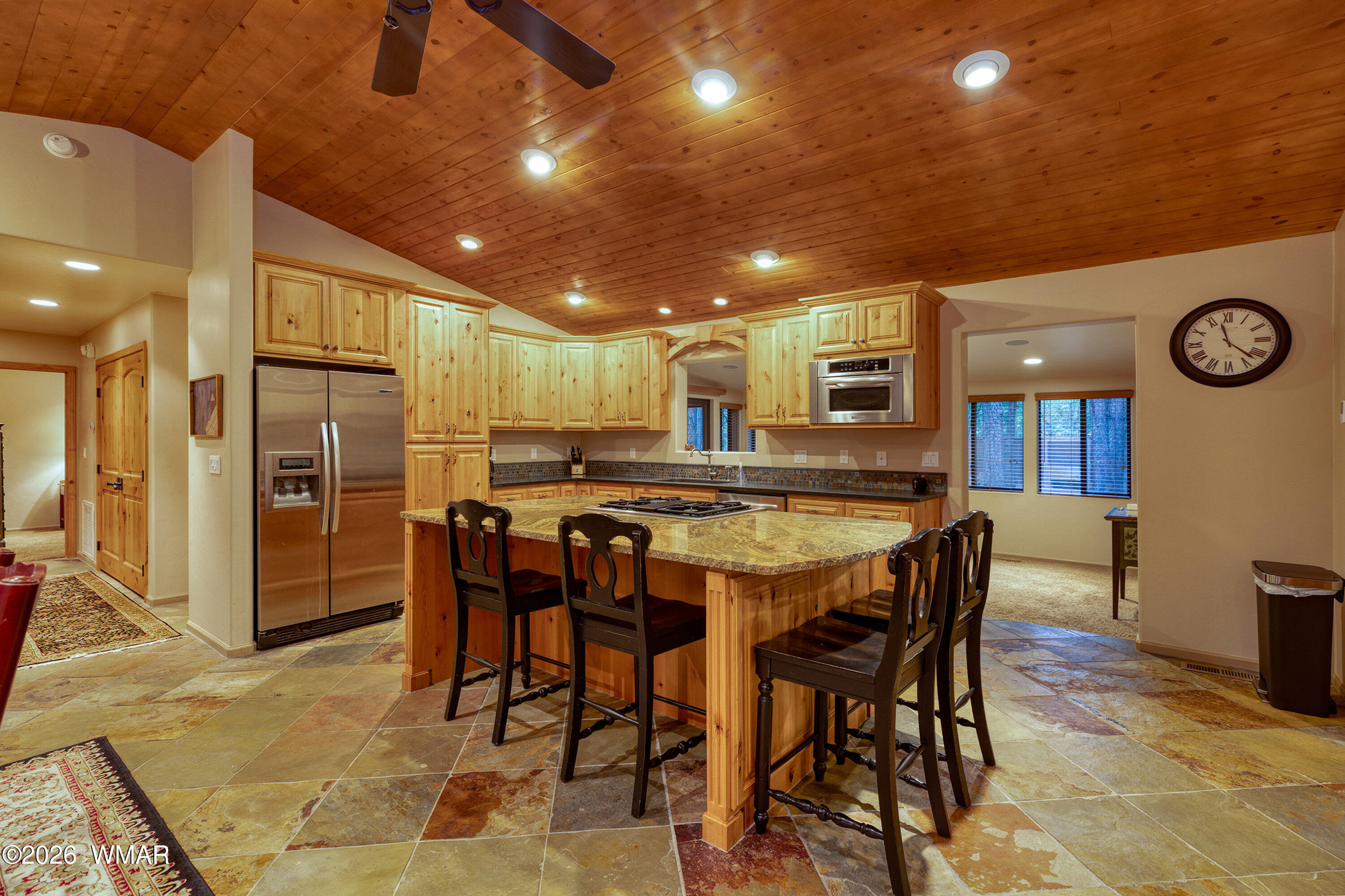 5155 Buck Springs Road Pinetop, AZ 85935 - Photo 8 of 37 a large kitchen with a table and chairs