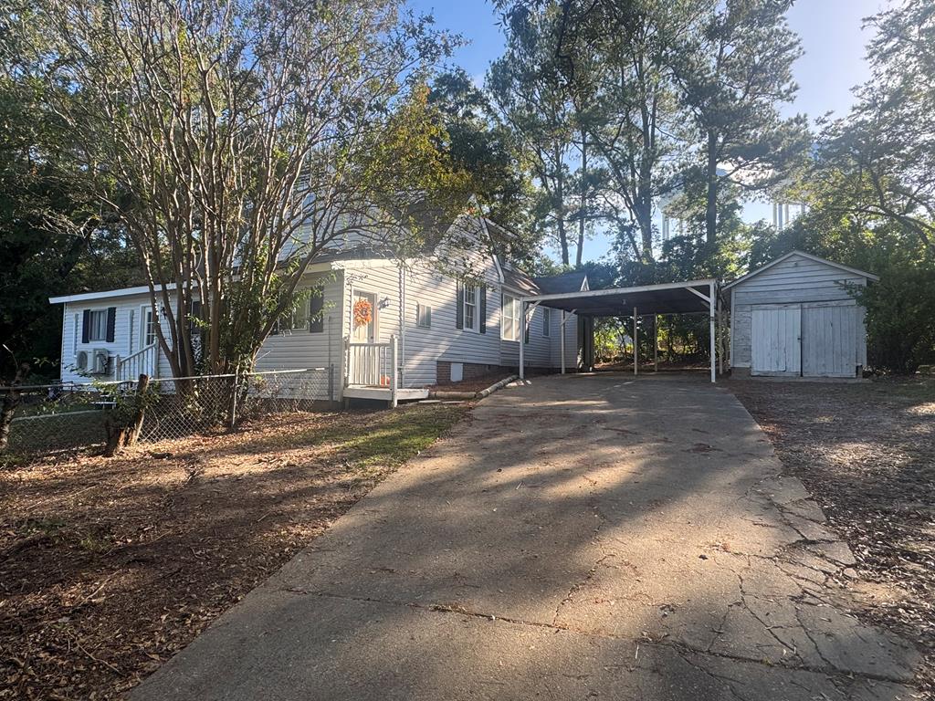3604 Norris Road Columbus, GA 31907 - Photo 27 of 29 rear driveway w carport, storage bldg