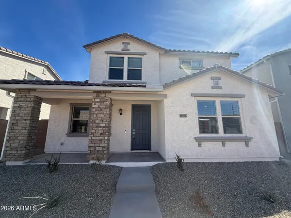 front view of a house with a yard