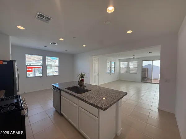 a kitchen with sink and window