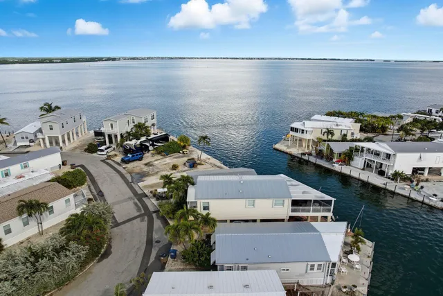 an aerial view of a houses with outdoor space