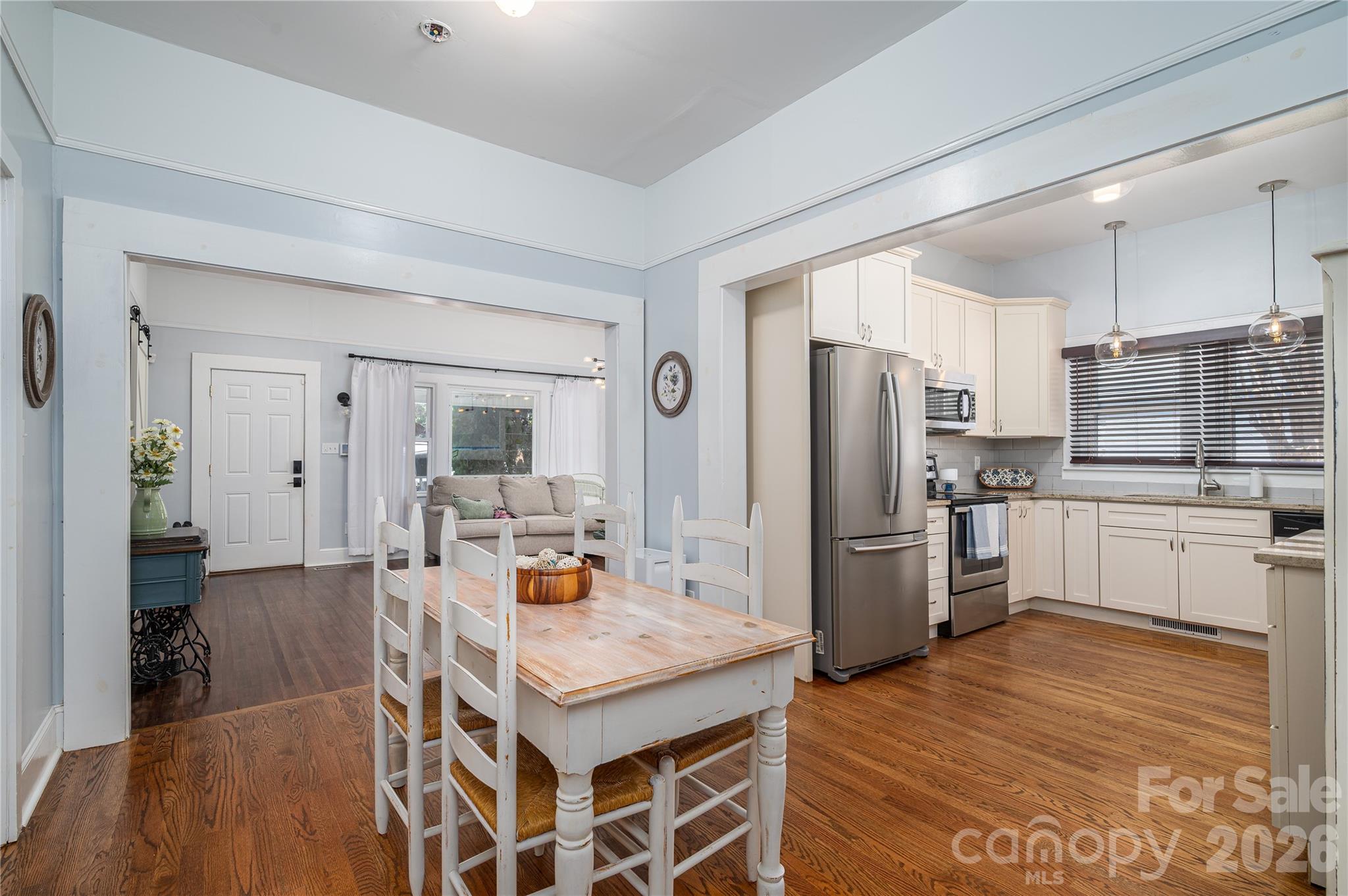 58 Fourth Street Cramerton, NC 28032 - Photo 19 of 44 a kitchen with stainless steel appliances a refrigerator and a stove top oven