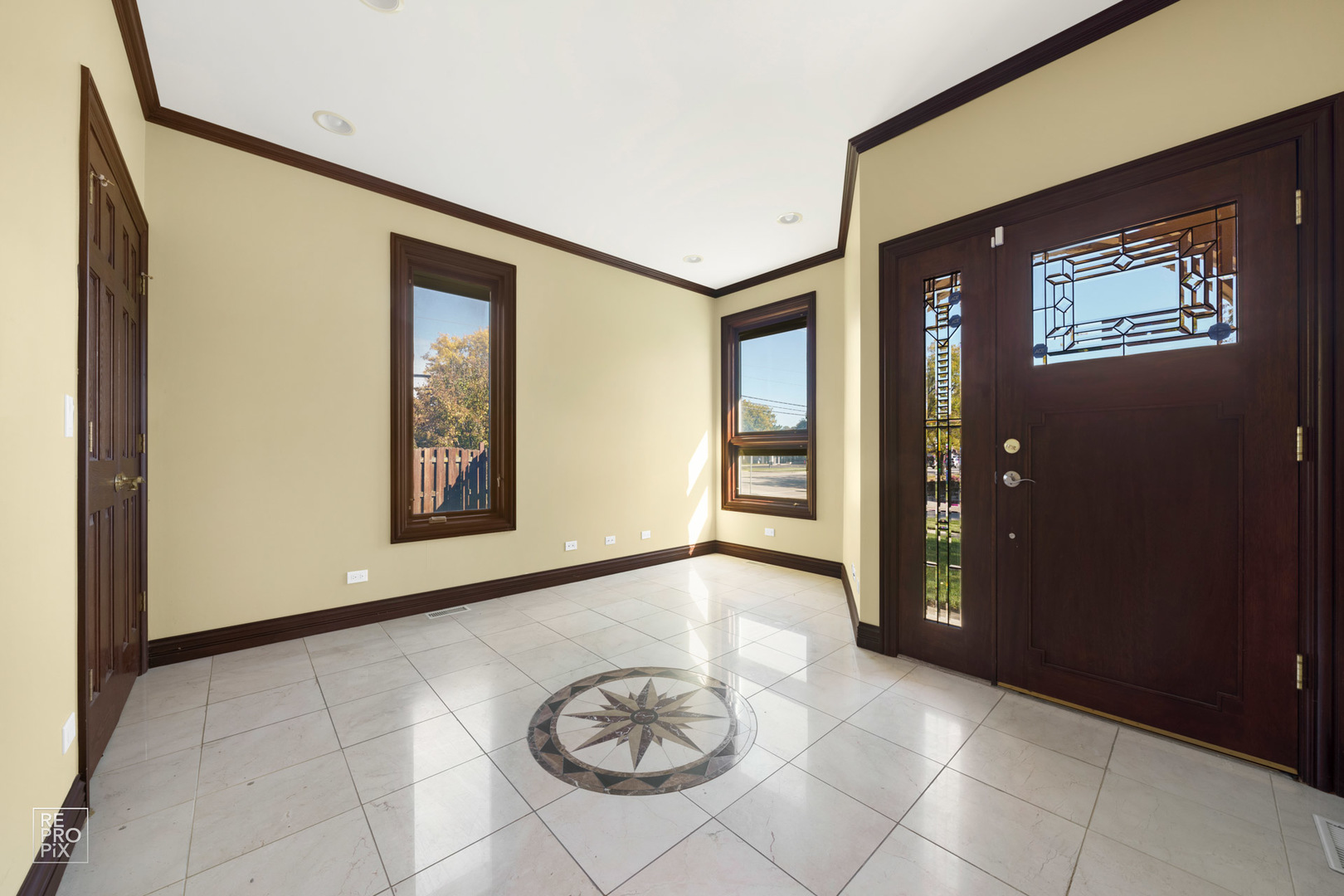 916 Elmdale Road Glenview, IL 60025 - Photo 3 of 20 a view of a hallway with entryway and window