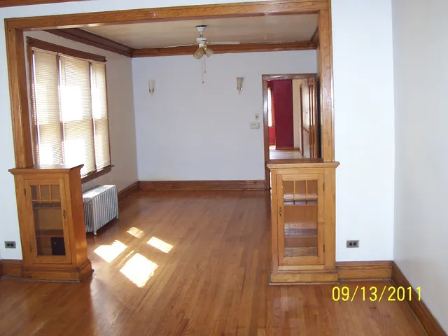 a view of an entryway with wooden floor