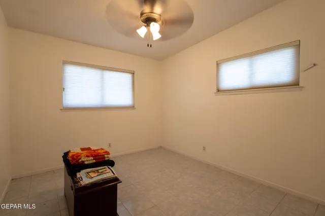 a view of room with cabinet and flat screen tv