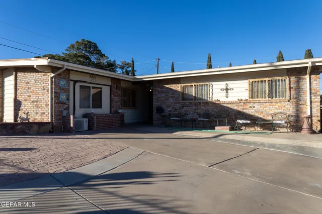 a view of a house with a street