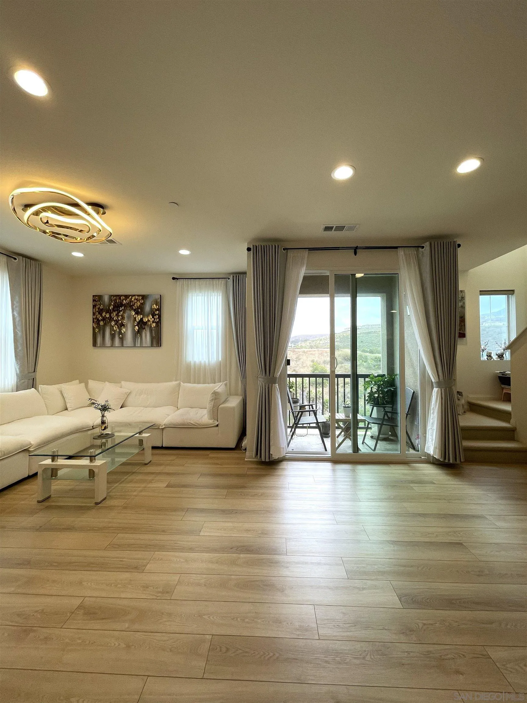 2708 Juniper Berry Street Spring Valley, CA 91977 - Photo 1 of 39 a living room with furniture and a large window