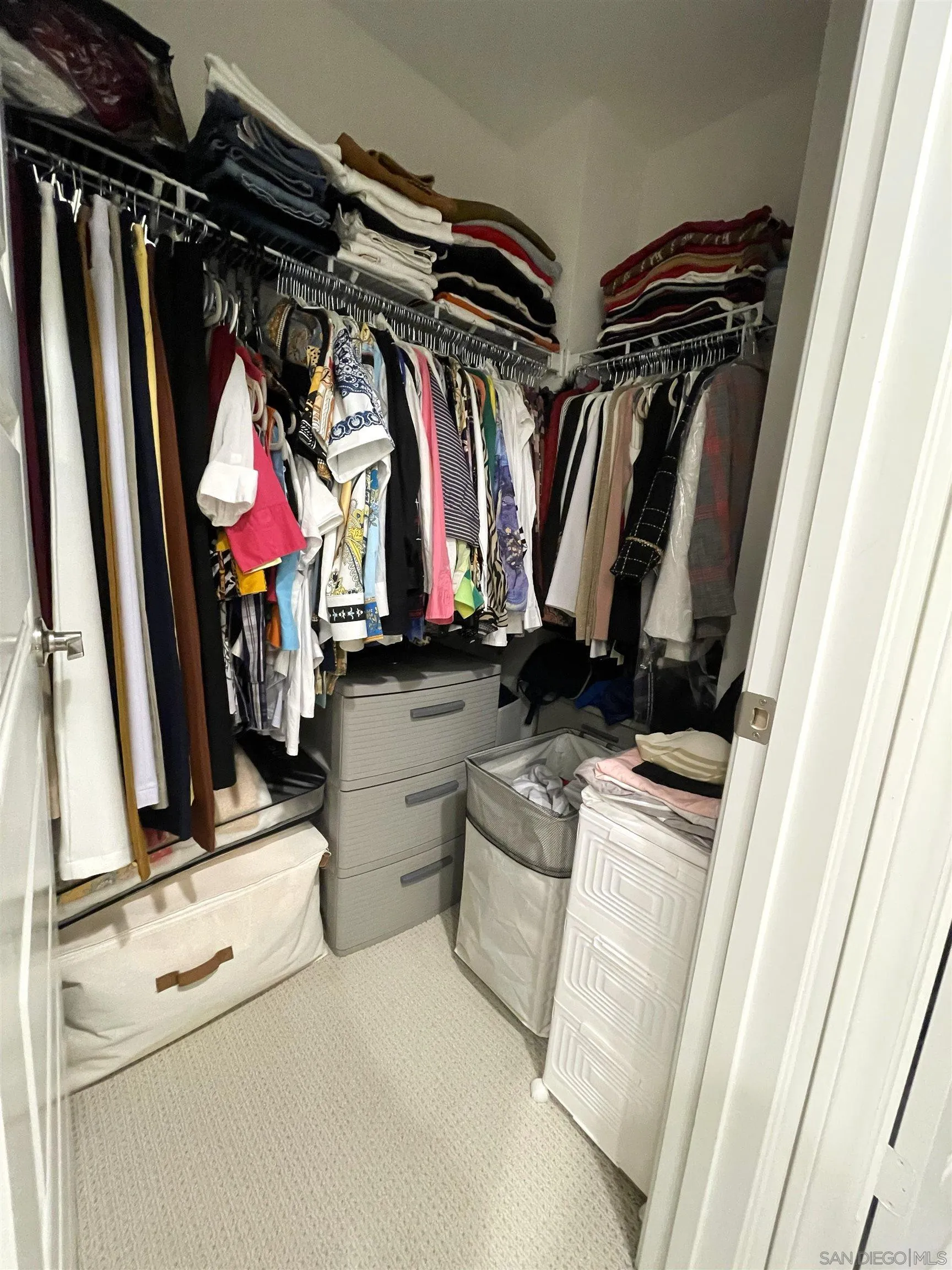 2708 Juniper Berry Street Spring Valley, CA 91977 - Photo 12 of 39 a view of walk in closet with clothes and shoes