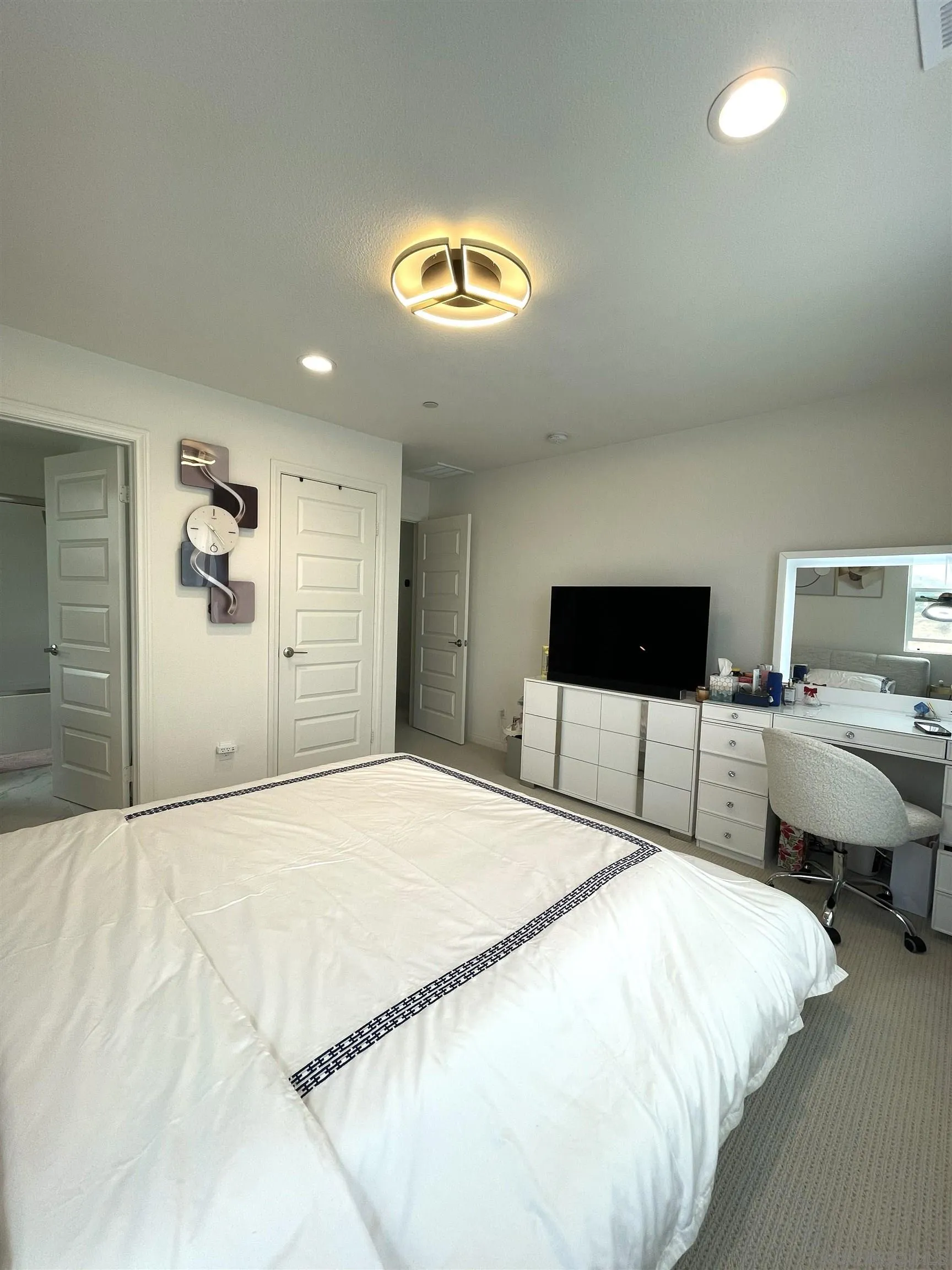 2708 Juniper Berry Street Spring Valley, CA 91977 - Photo 14 of 39 a bedroom with a bed and a view of en suite bathroom