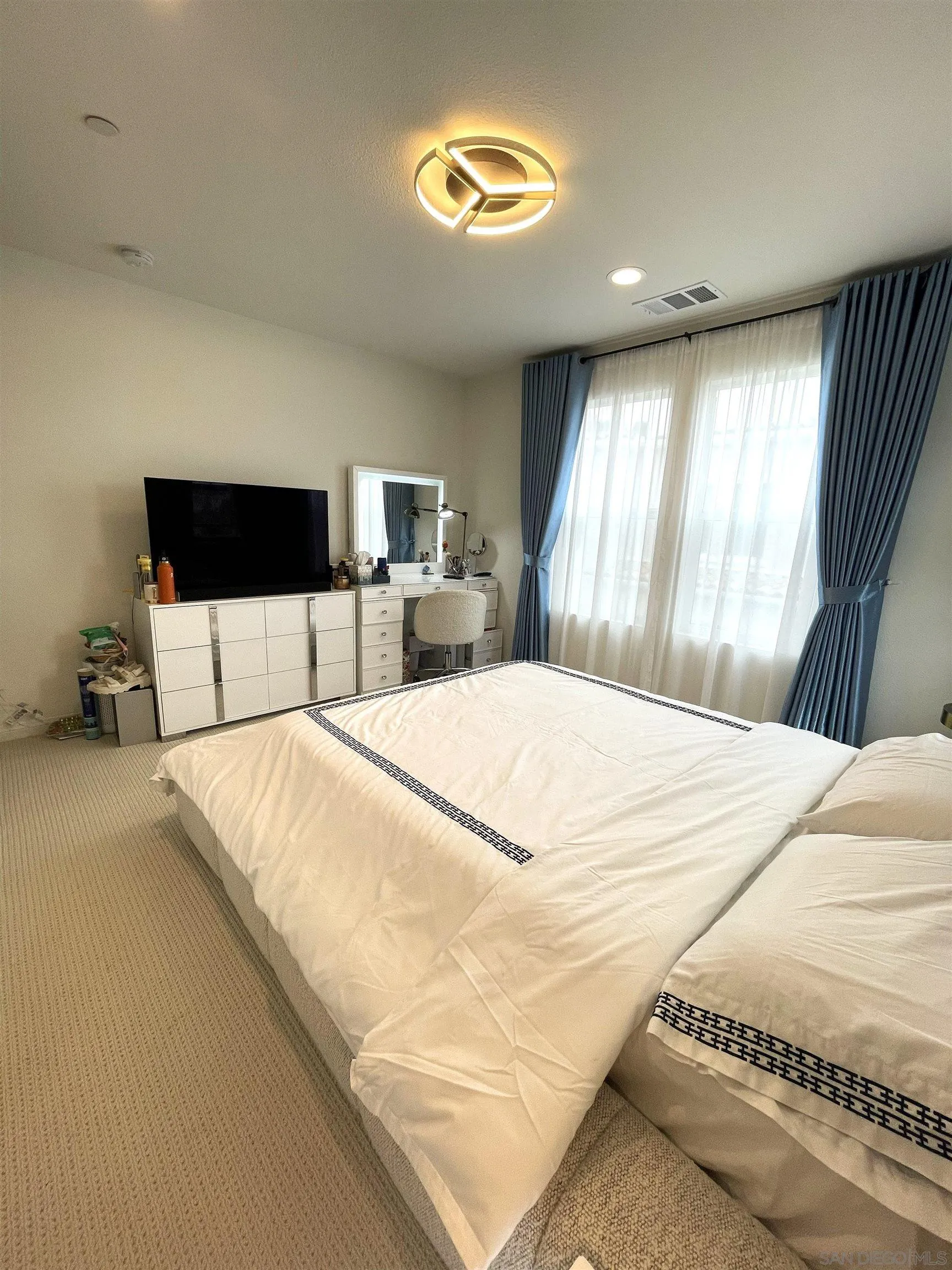 2708 Juniper Berry Street Spring Valley, CA 91977 - Photo 15 of 39 a bedroom with a bed and a large window