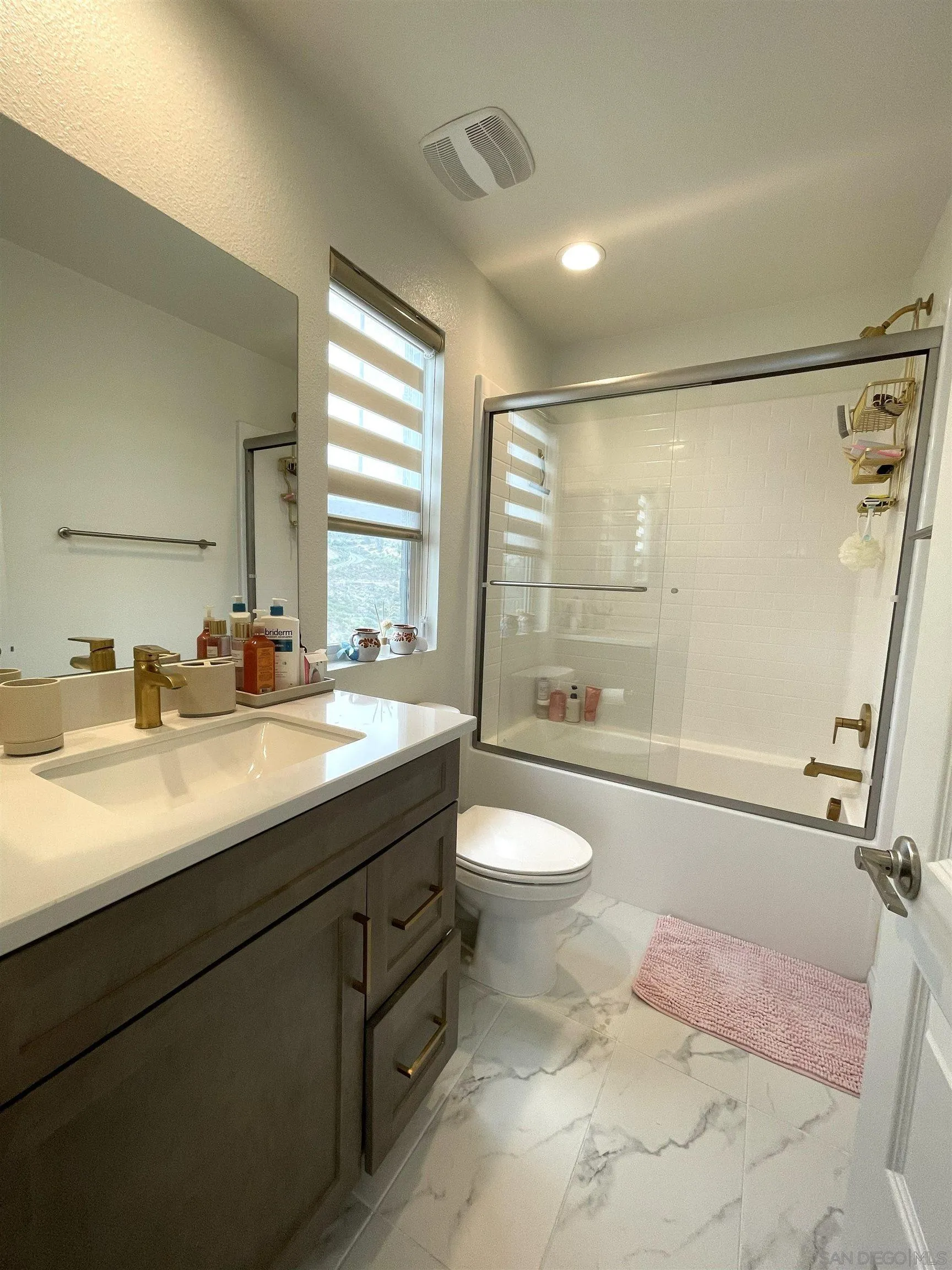 2708 Juniper Berry Street Spring Valley, CA 91977 - Photo 16 of 39 a bathroom with a sink a toilet and shower