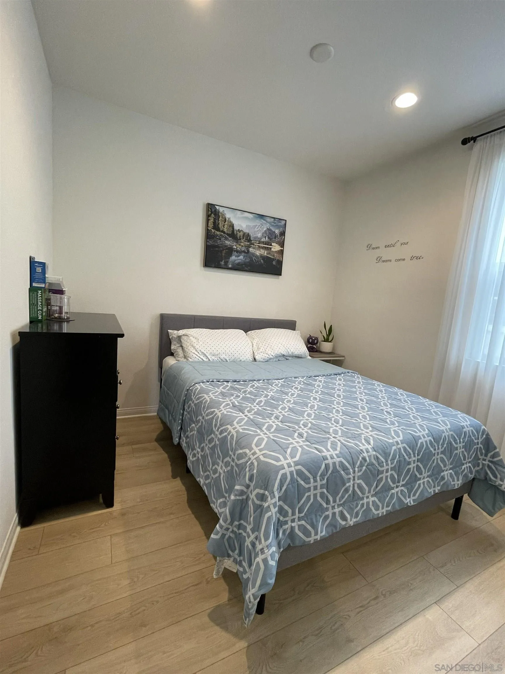 2708 Juniper Berry Street Spring Valley, CA 91977 - Photo 23 of 39 a bedroom with a bed and wooden floor