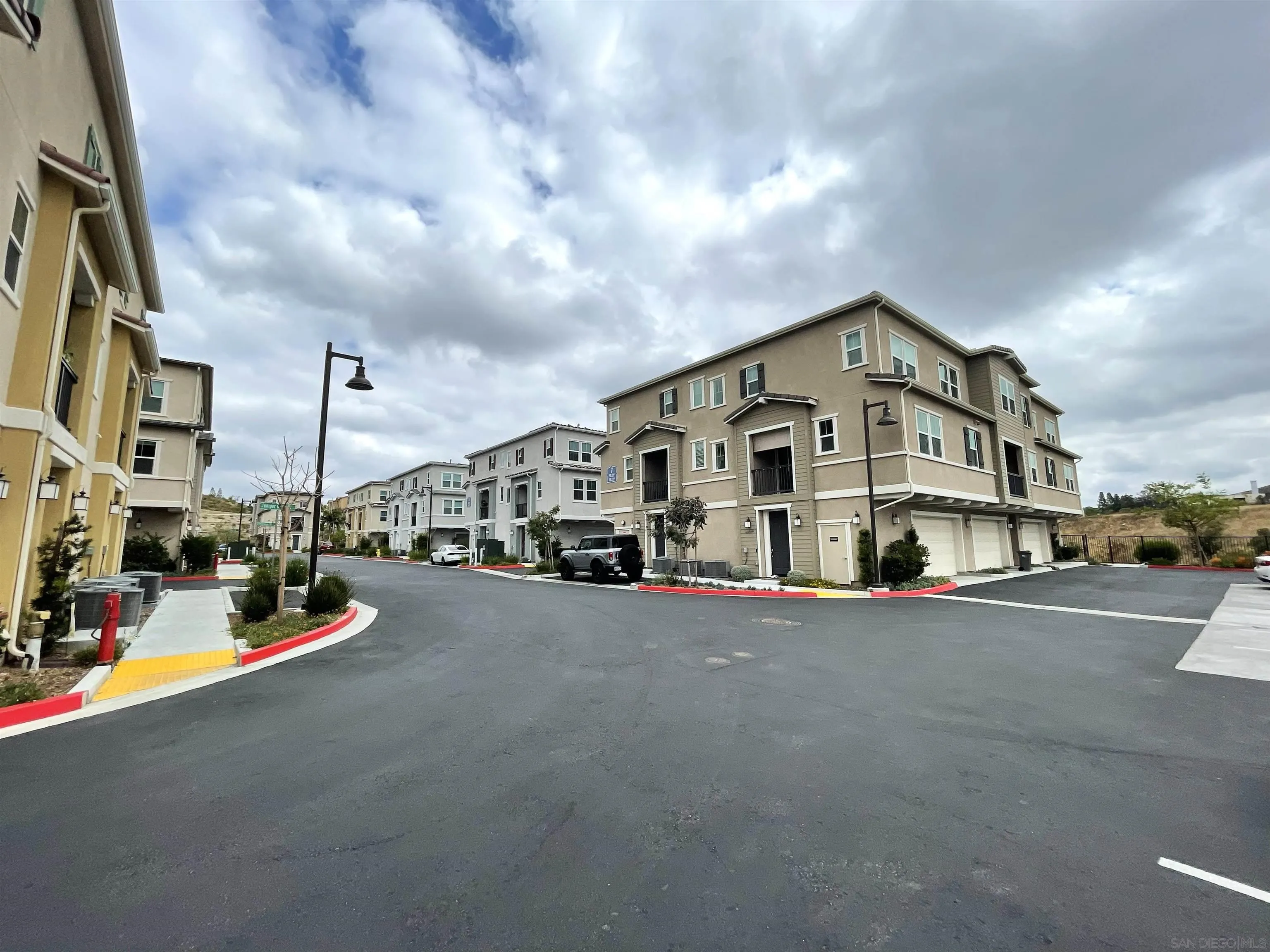 2708 Juniper Berry Street Spring Valley, CA 91977 - Photo 36 of 39 a view of a street with cars on both side