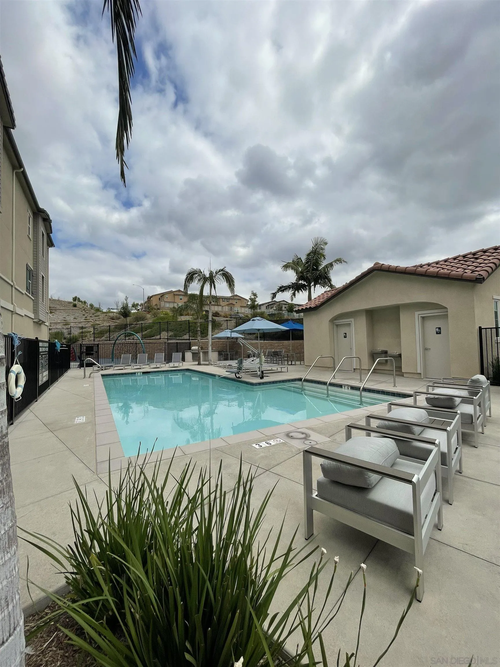 2708 Juniper Berry Street Spring Valley, CA 91977 - Photo 38 of 39 a roof deck with table and chairs and wooden floor