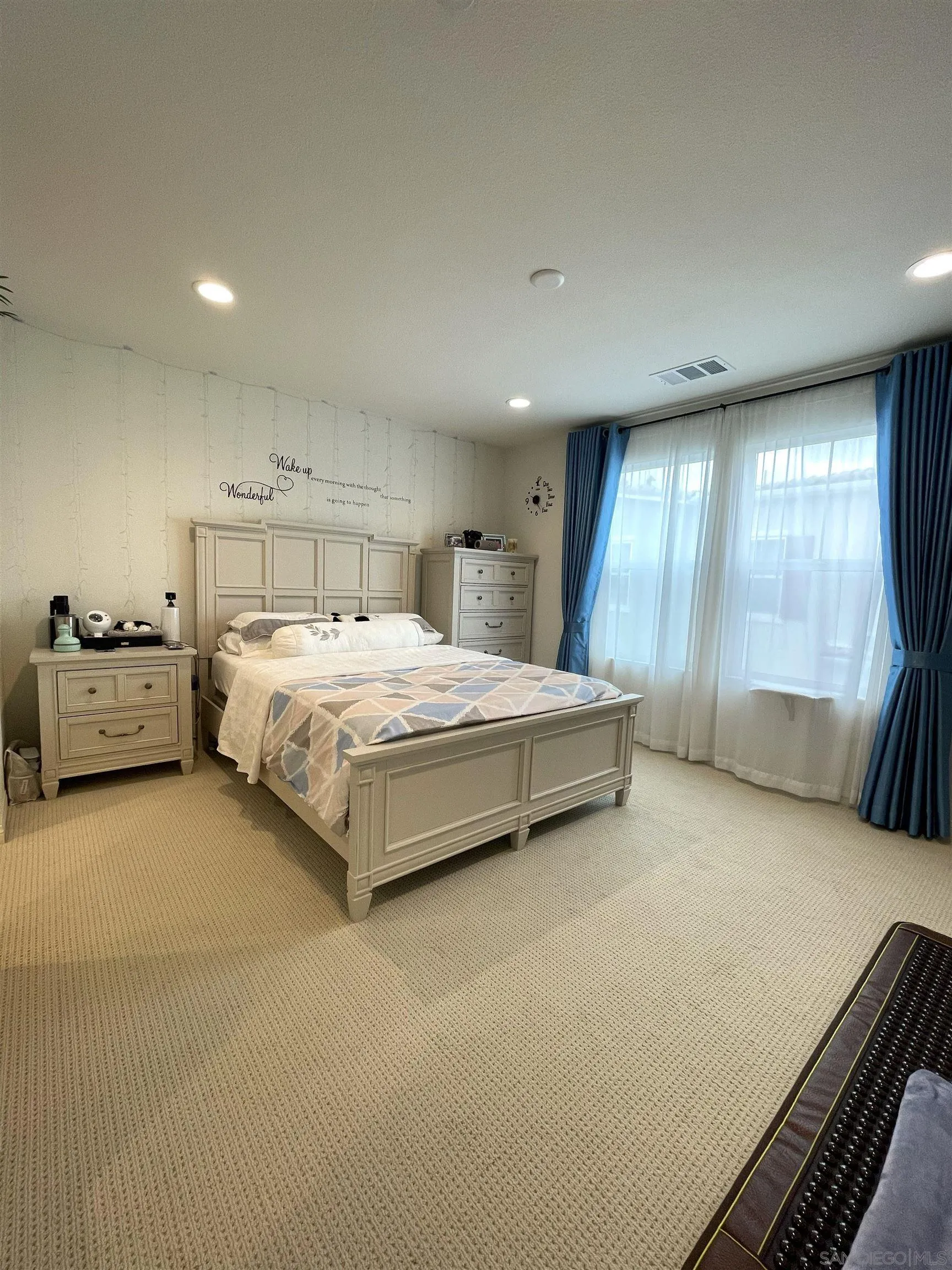 2708 Juniper Berry Street Spring Valley, CA 91977 - Photo 7 of 39 a spacious bedroom with a bed and a large window