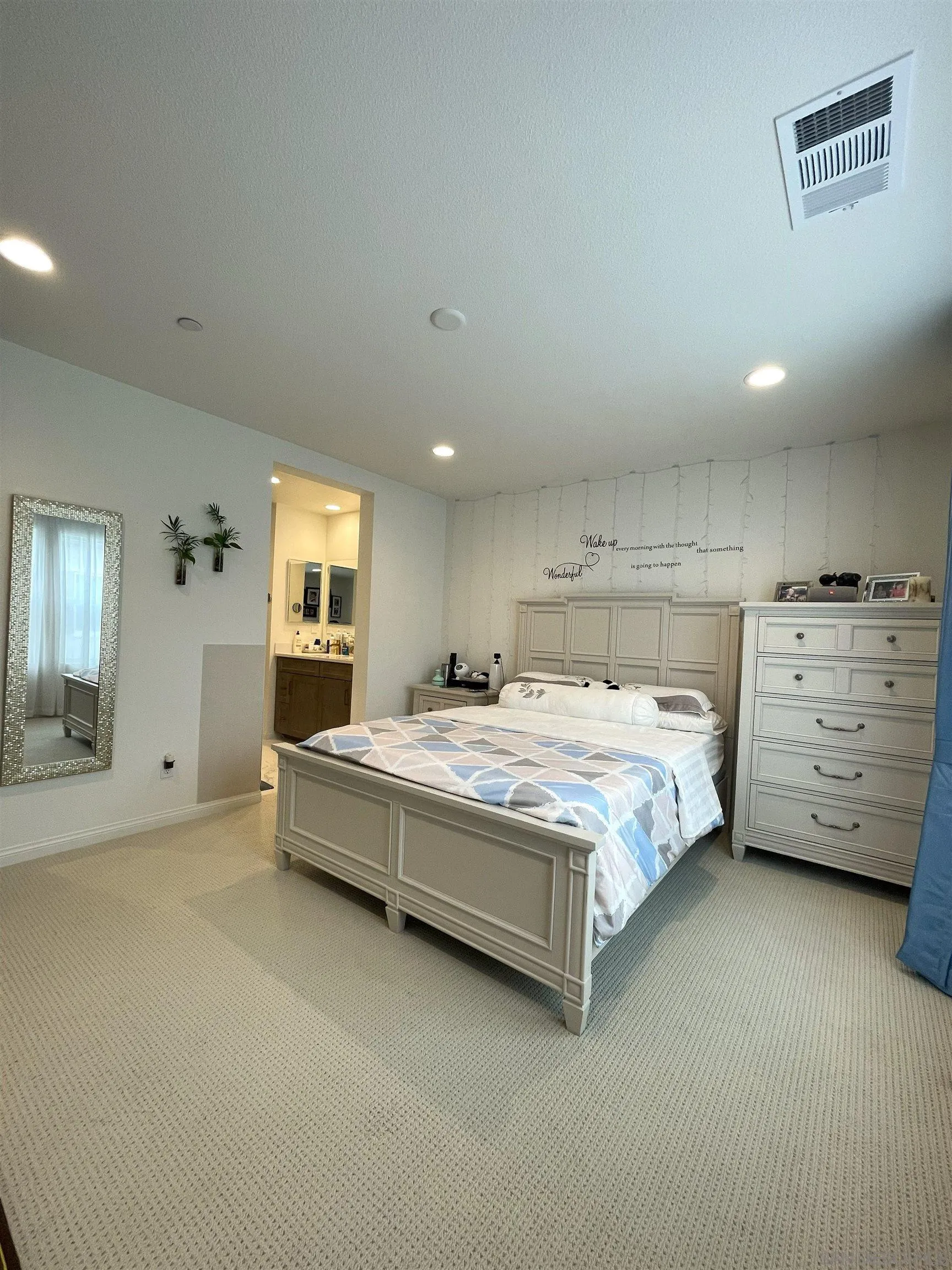 2708 Juniper Berry Street Spring Valley, CA 91977 - Photo 8 of 39 a spacious bedroom with a bed and a couch