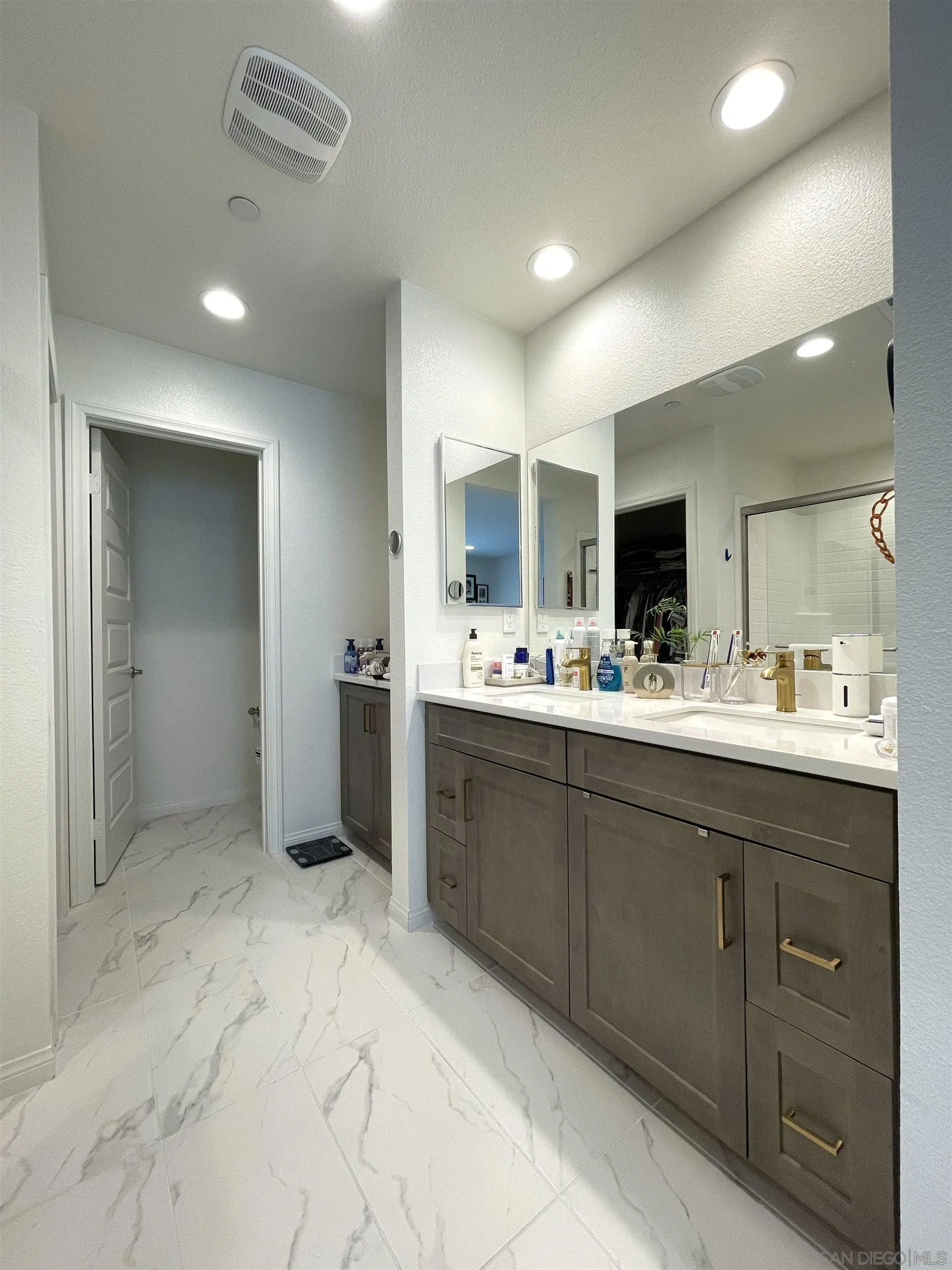 2708 Juniper Berry Street Spring Valley, CA 91977 - Photo 10 of 39 a bathroom with a sink double vanity and a mirror