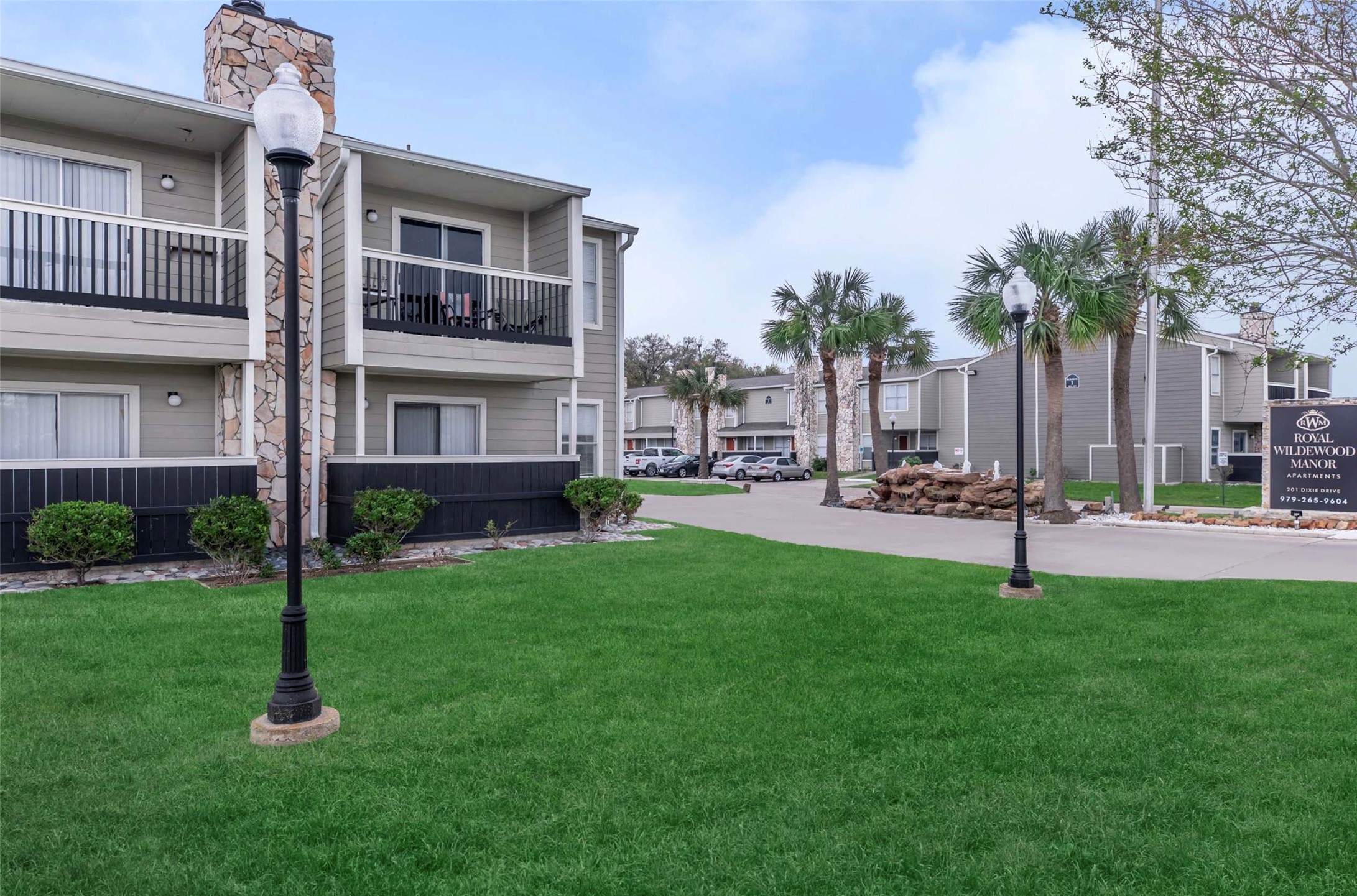 201 Dixie Drive Clute, TX 77531 - Photo 8 of 11 a garden with trees in front of it