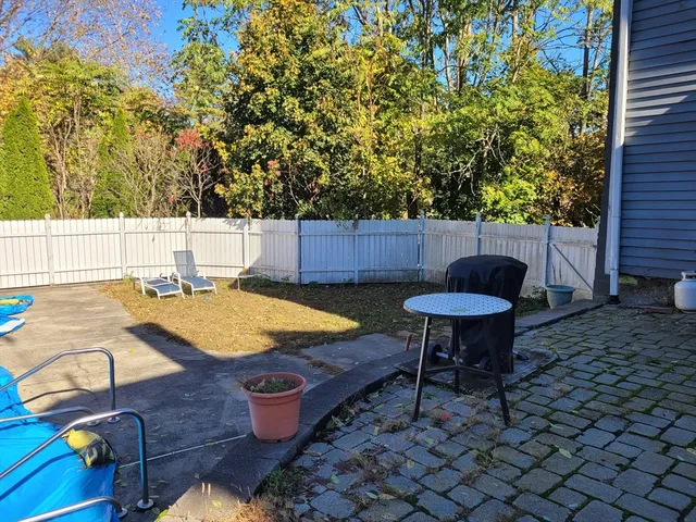 a view of a chairs and table in the patio