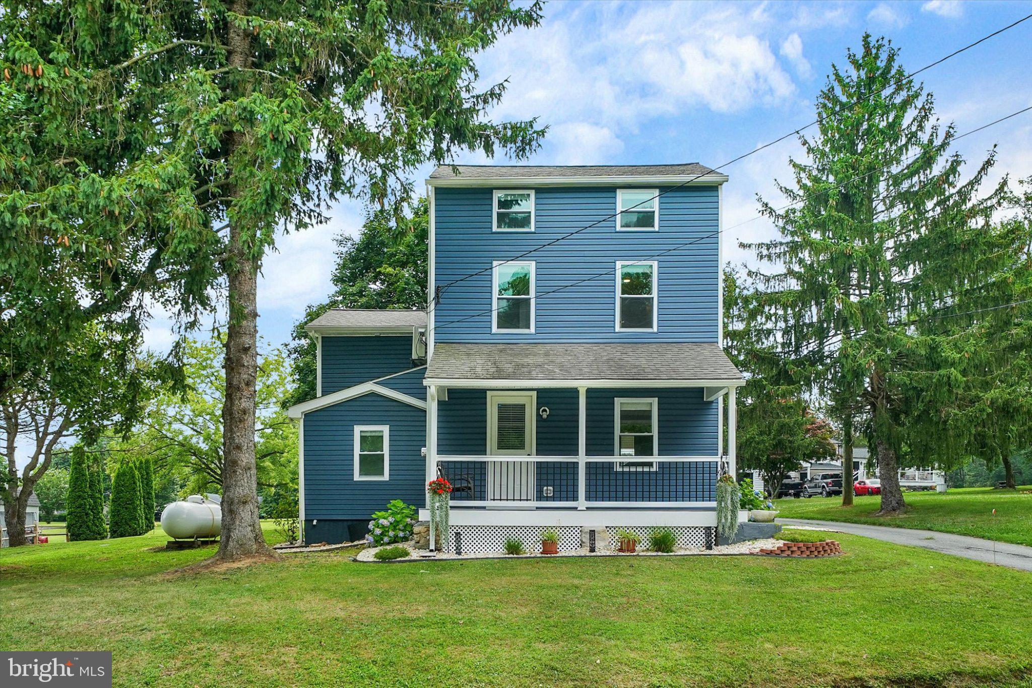 1847 Blue Ball Road Elkton, MD 21921 - Photo 5 of 45 Charming blue home with lush greenery.