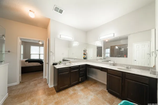 a large bathroom with a large tub and sink