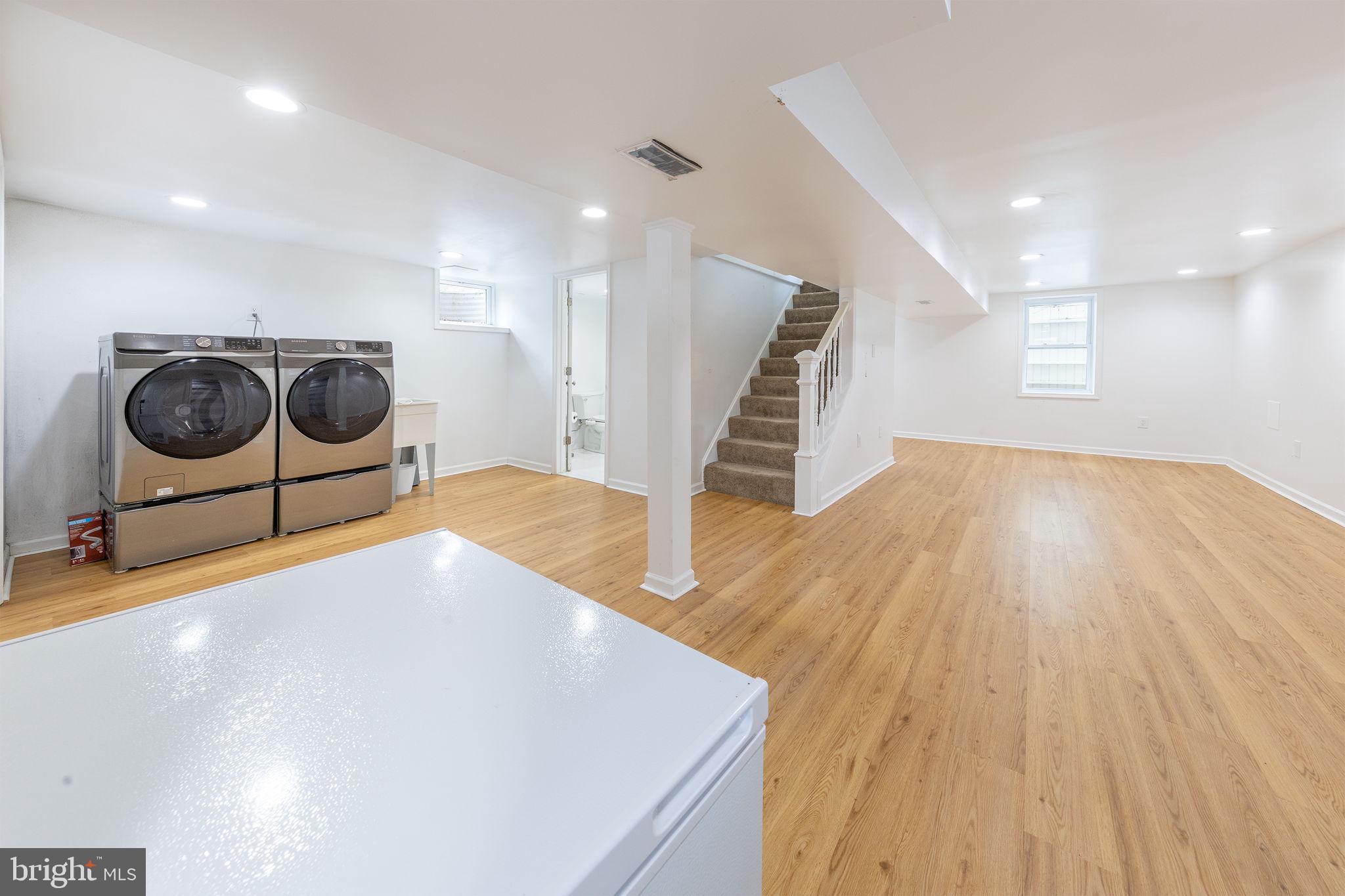 12112 Atherton Drive Silver Spring, MD 20902 - Photo 15 of 32 a view of a kitchen with a sink and wooden floor