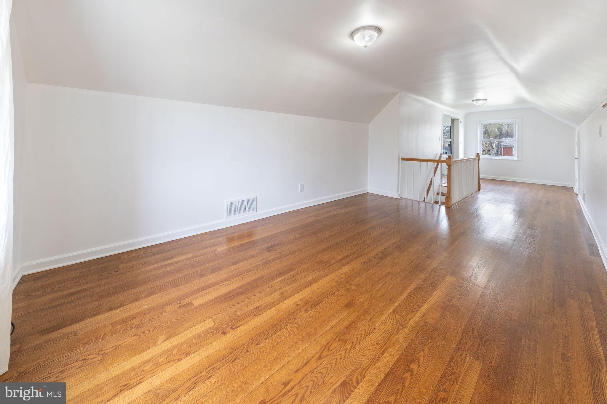 12112 Atherton Drive Silver Spring, MD 20902 - Photo 19 of 32 a view of empty room with wooden floor