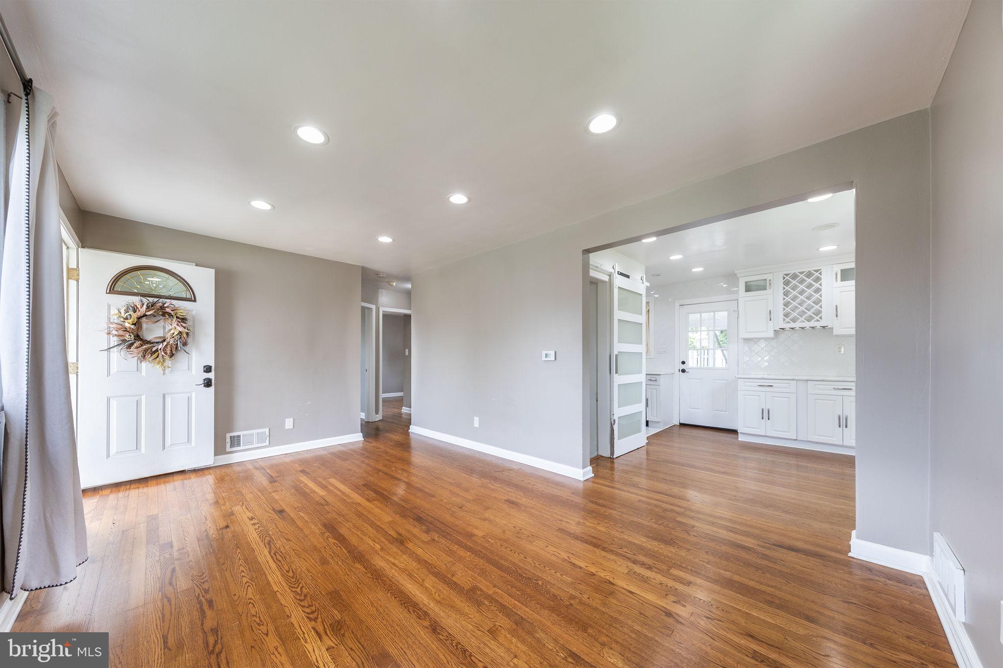 12112 Atherton Drive Silver Spring, MD 20902 - Photo 2 of 32 a view of a big room with wooden floor and a window
