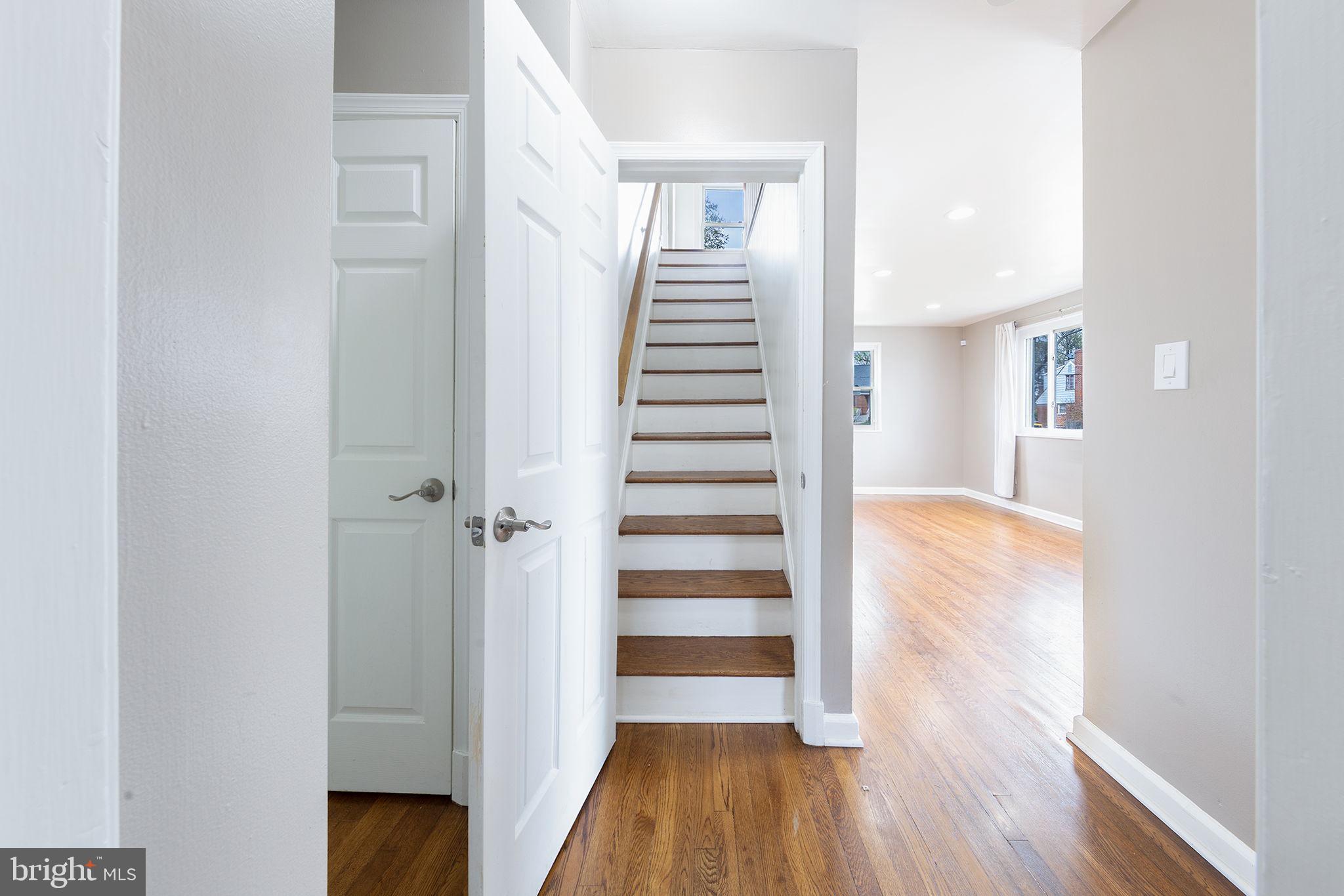 12112 Atherton Drive Silver Spring, MD 20902 - Photo 21 of 32 a view of a hallway with wooden floor and entryway