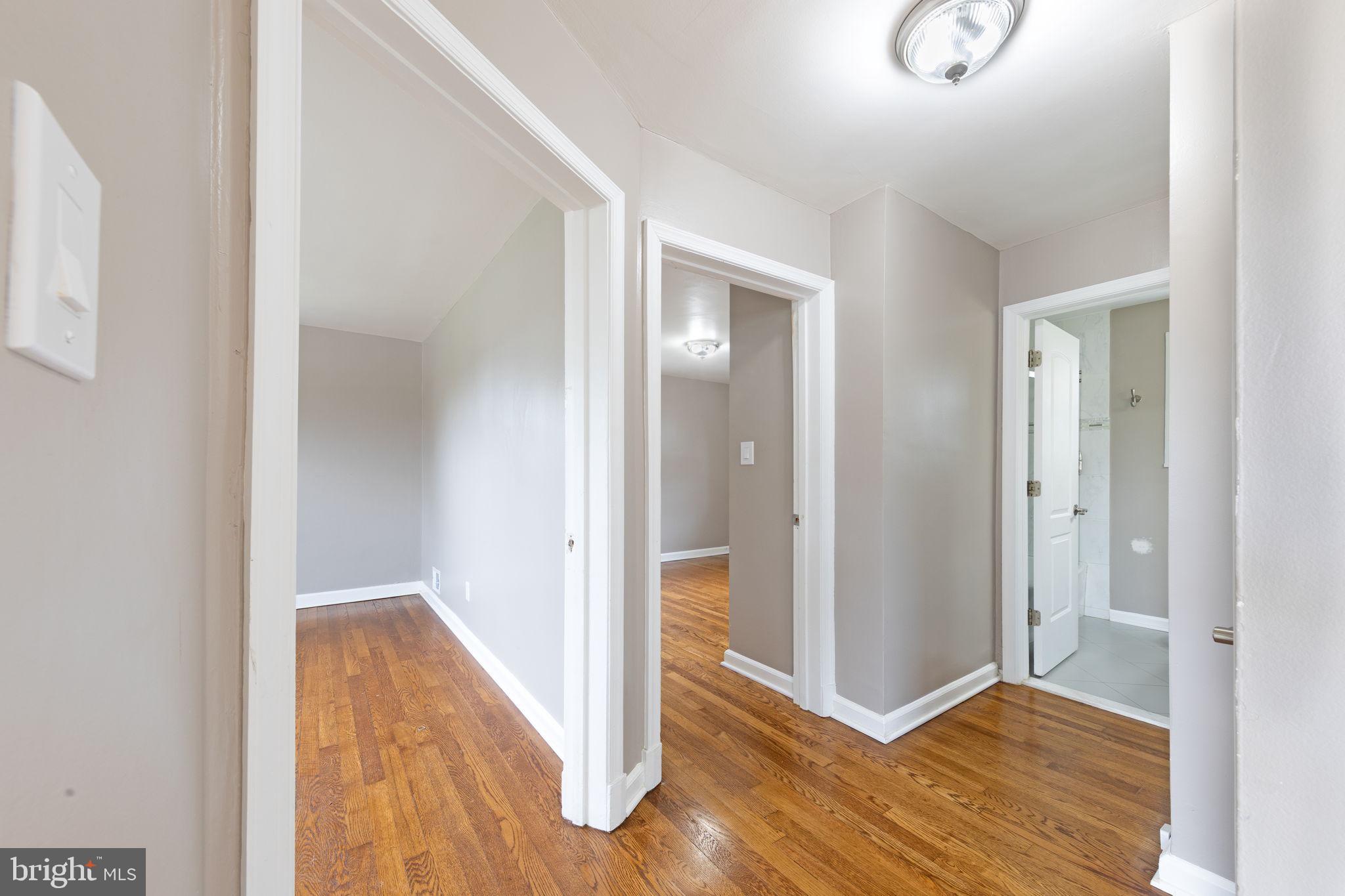 12112 Atherton Drive Silver Spring, MD 20902 - Photo 9 of 32 a view of hallway with wooden floor