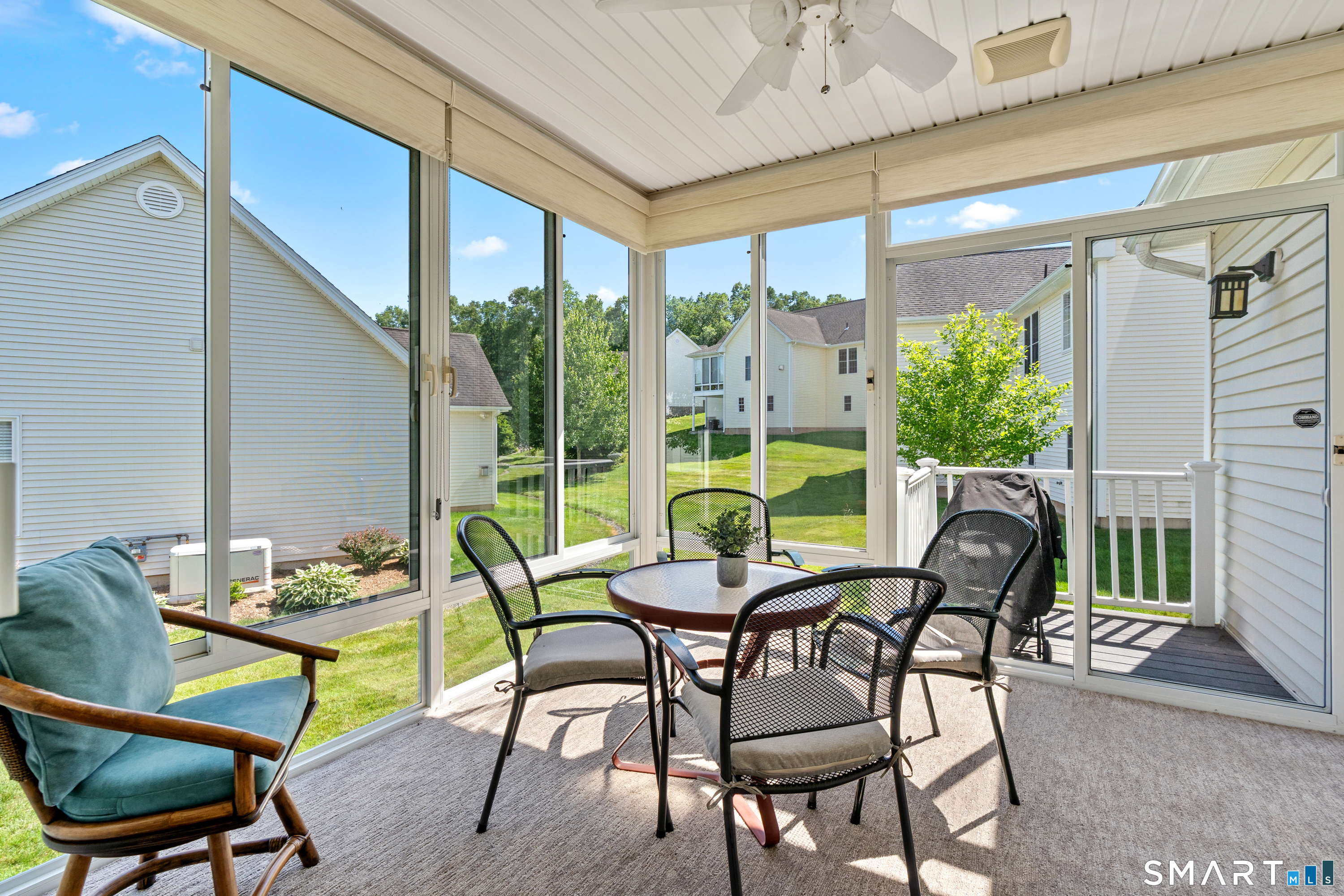 31 Gooseberry Road Suffield, CT 06078 - Photo 7 of 33 a patio with yard glass top table and chairs