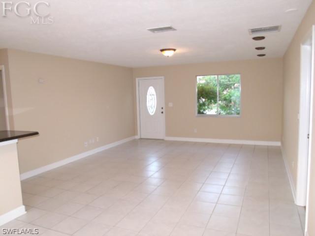 17476 Duquesne Road Fort Myers, FL 33967 - Photo 12 of 23 an empty room with windows