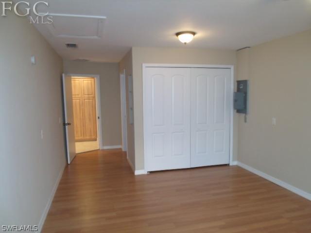 17476 Duquesne Road Fort Myers, FL 33967 - Photo 13 of 23 a view of an empty room and wooden floor