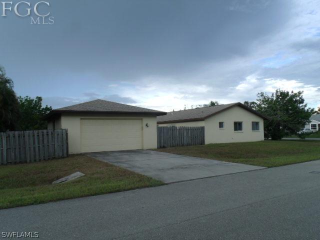 17476 Duquesne Road Fort Myers, FL 33967 - Photo 21 of 23 a front view of house with yard and trees