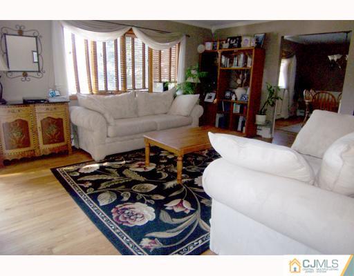 768 Old Raritan Road Edison, NJ 08820 - Photo 2 of 10 a living room with furniture and a fireplace