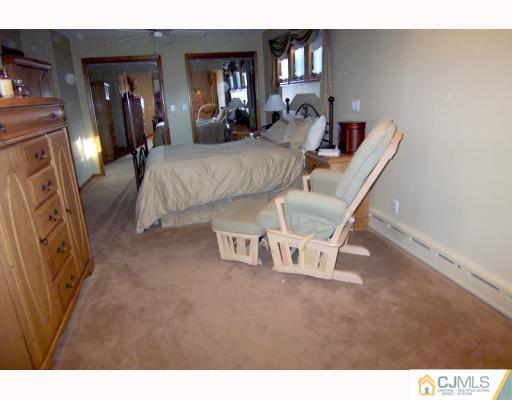 768 Old Raritan Road Edison, NJ 08820 - Photo 5 of 10 a living room with furniture and a mirror