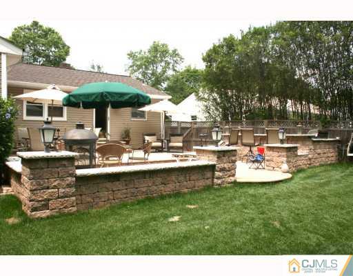 768 Old Raritan Road Edison, NJ 08820 - Photo 8 of 10 a view of a house with a backyard patio and swimming pool