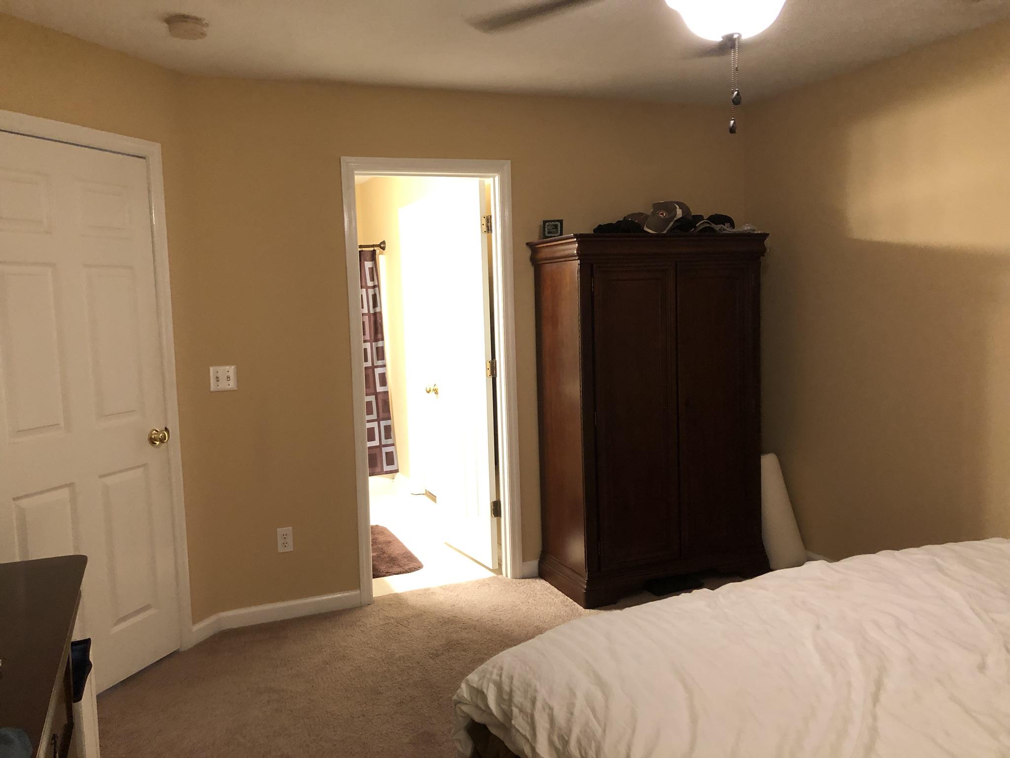 109 Brookside Point Springfield, TN 37172 - Photo 24 of 26 a bedroom with a bed and wooden floor