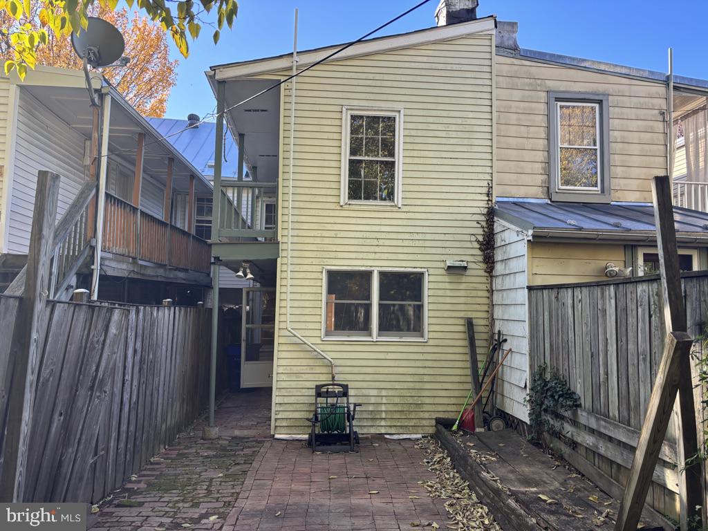 121 East 4th Street Frederick, MD 21701 - Photo 20 of 21 a view of a house with a yard and wooden fence