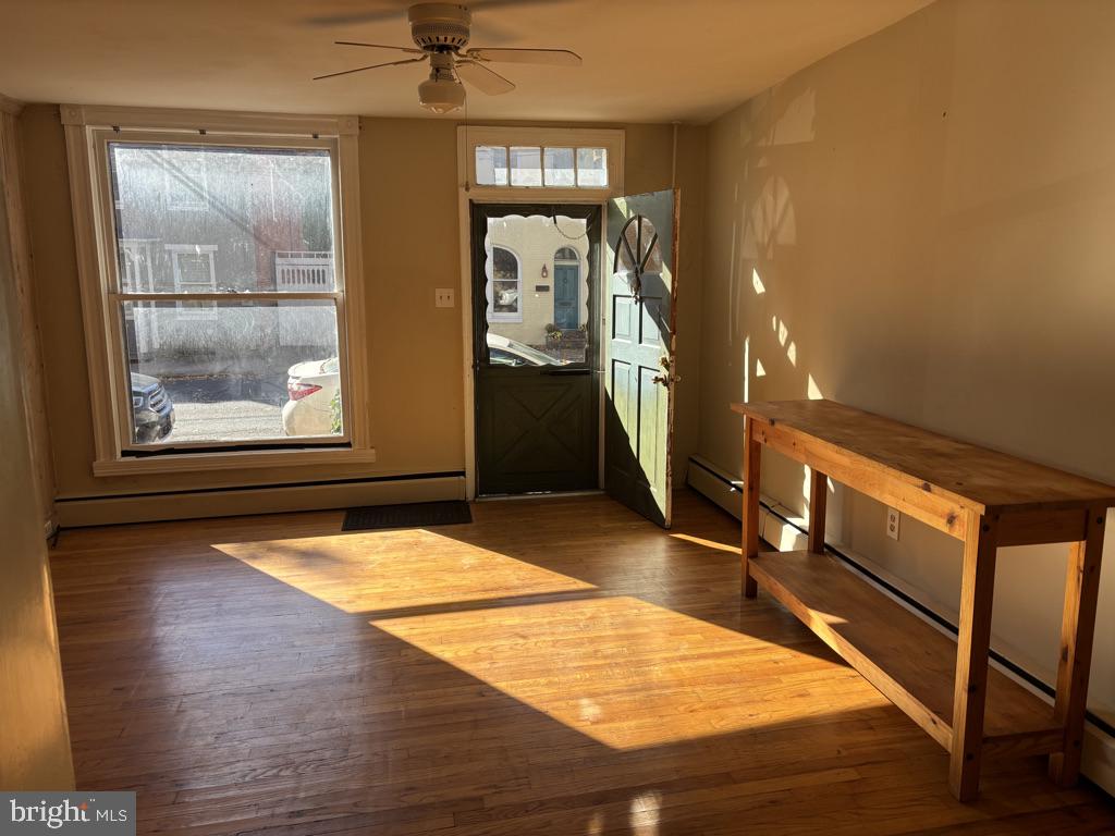 121 East 4th Street Frederick, MD 21701 - Photo 2 of 21 a room with wooden floor and windows