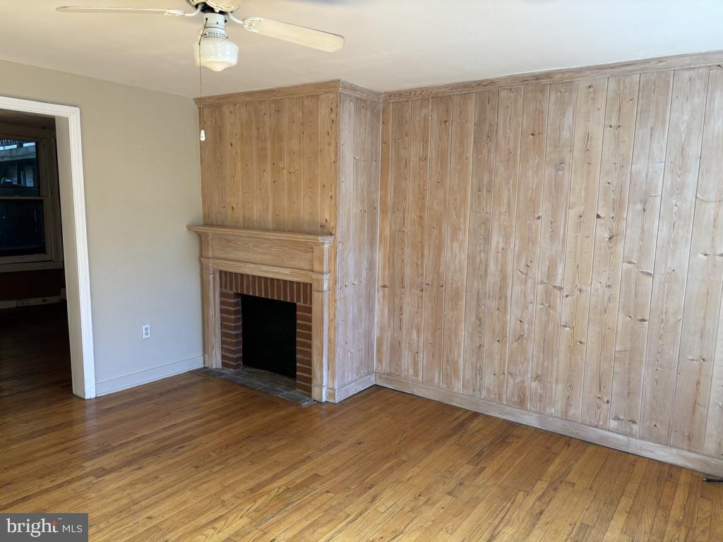 121 East 4th Street Frederick, MD 21701 - Photo 3 of 21 a view of a livingroom with a fireplace wooden floor and window