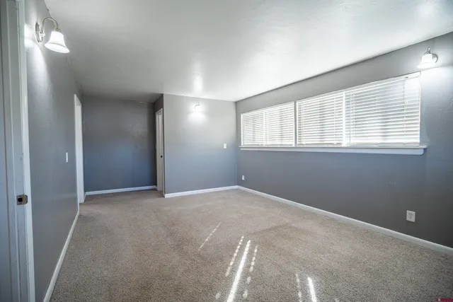 a view of a backyard with sitting area