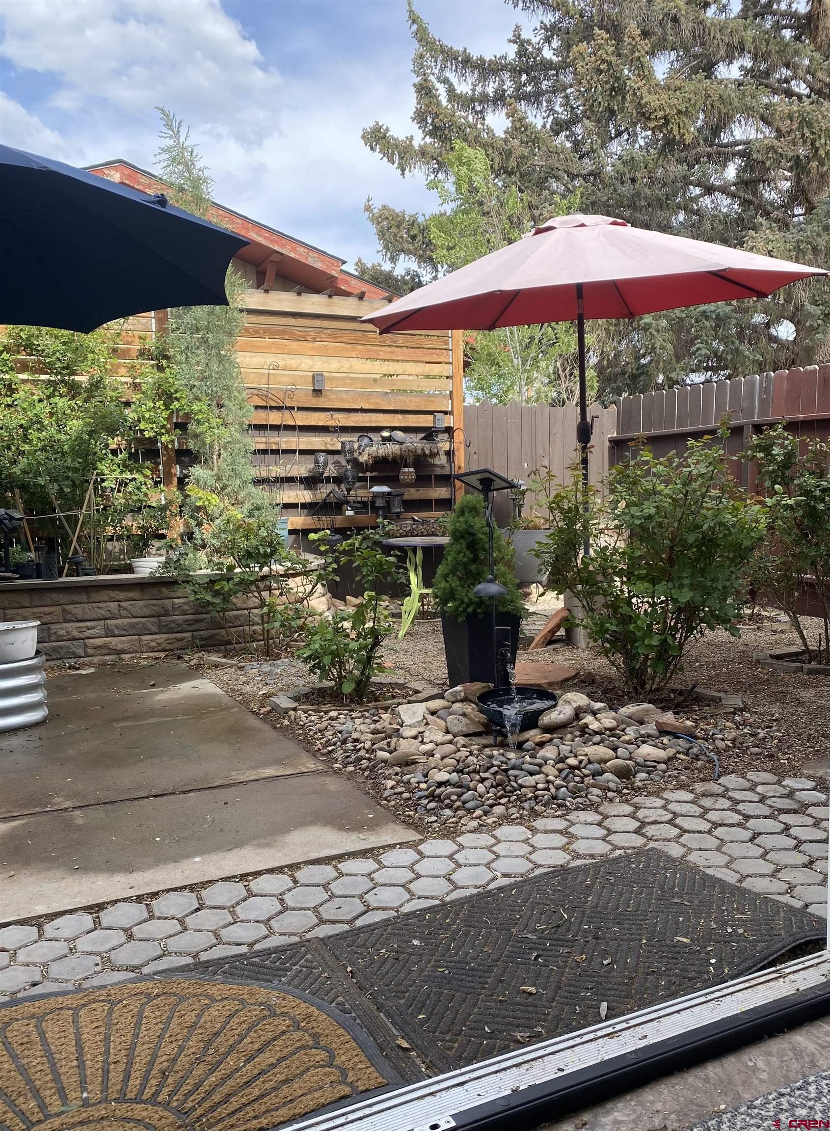 1702 East MacArthur Avenue Cortez, CO 81321 - Photo 30 of 42 a view of a backyard with sitting area