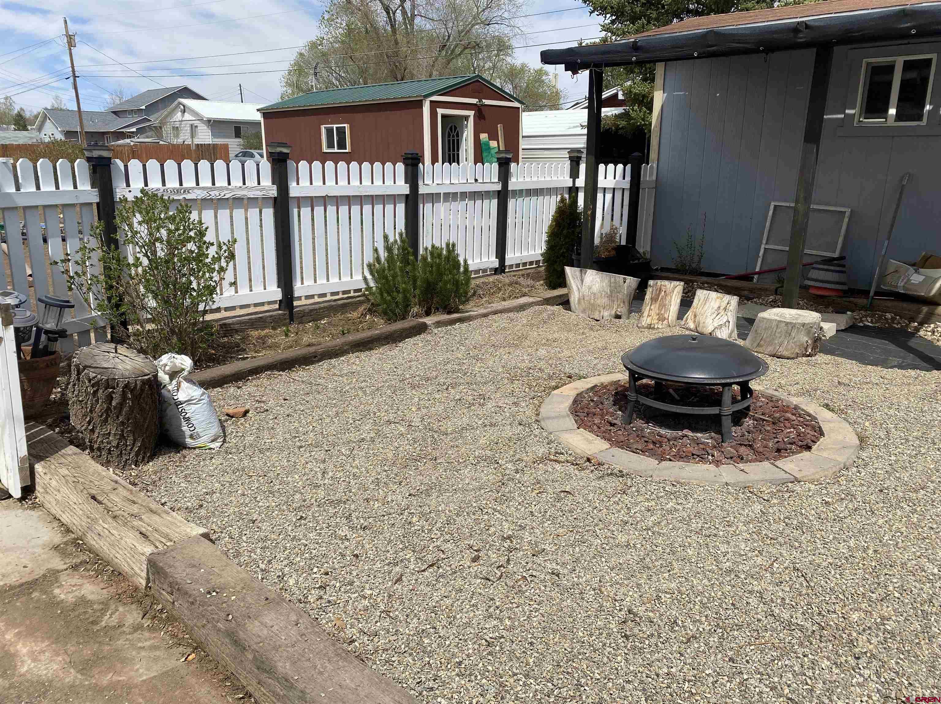 1702 East MacArthur Avenue Cortez, CO 81321 - Photo 32 of 42 a view of a house with backyard and sitting area